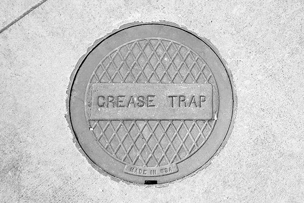 local regulations may require regular grease trap pumping to maintain compliance with environmental and health codes